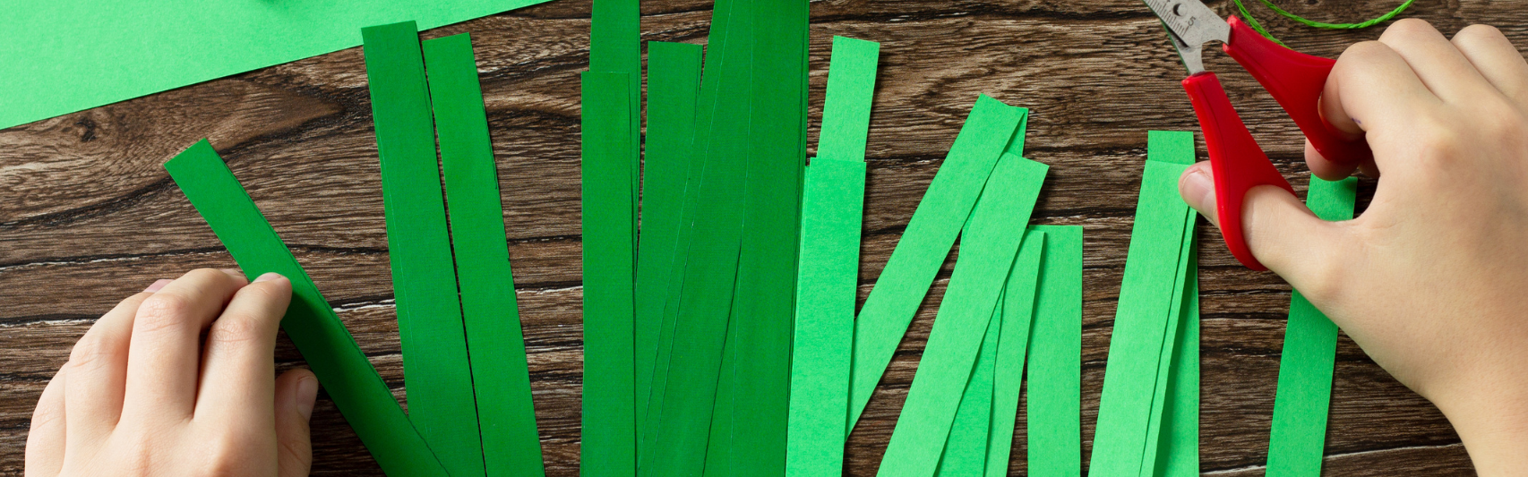 kuvituskuva vihreät kartonkisuikaleet
